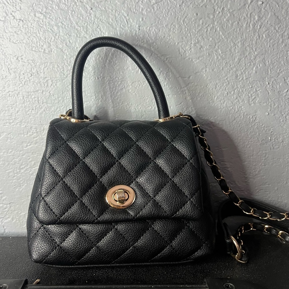 Black mini purse in great condition !